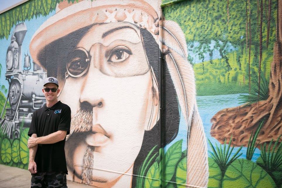 Derek Donnelly with mural photo